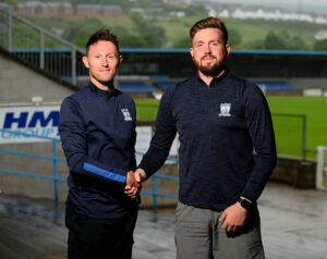 Assistant Manager Ryan Moffatt with Signing Jason Craughwell